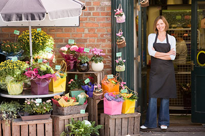 business owner standing outside flower shop